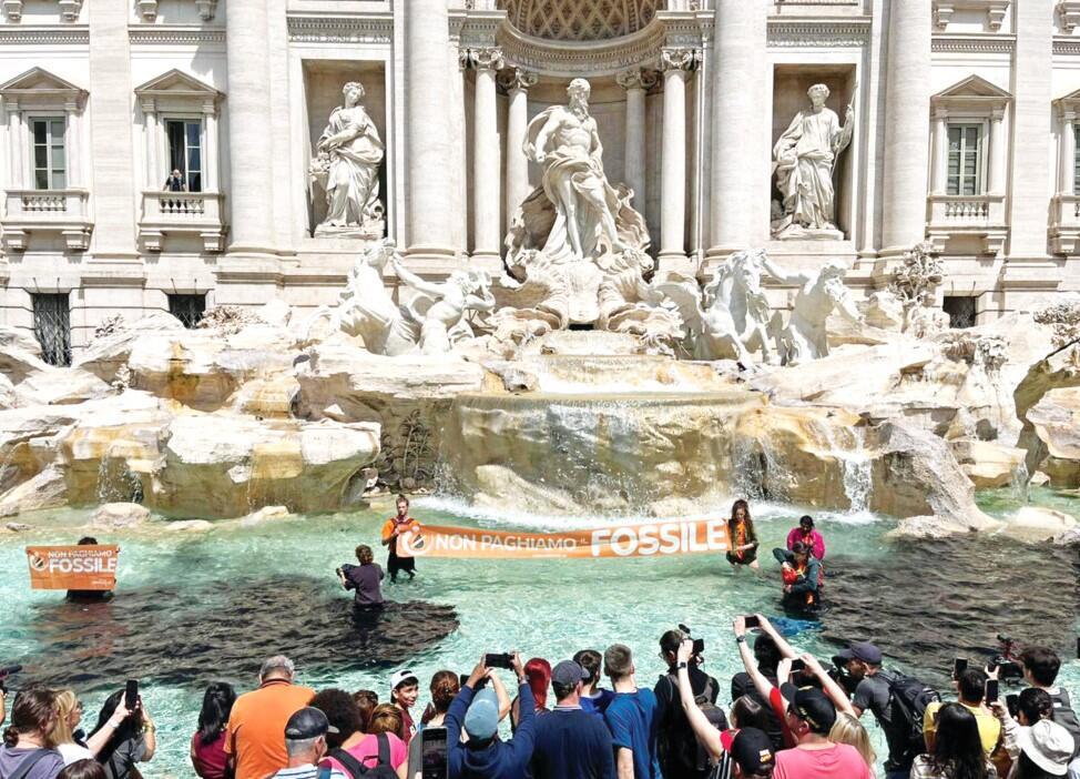 Climate activists turn Rome’s Trevi Fountain black