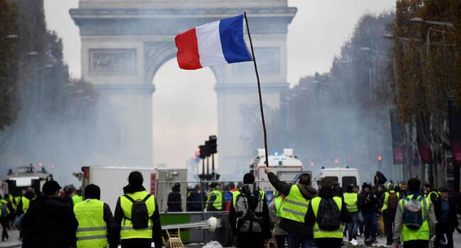 French police fire tear gas at fuel price protesters