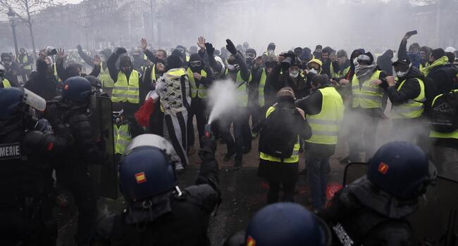 Protest clashes erupt in Paris at anti-Macron rallies
